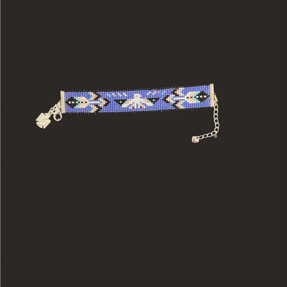 Hand crafted Adjustable Beaded Bracelet with Thunderbird and charms